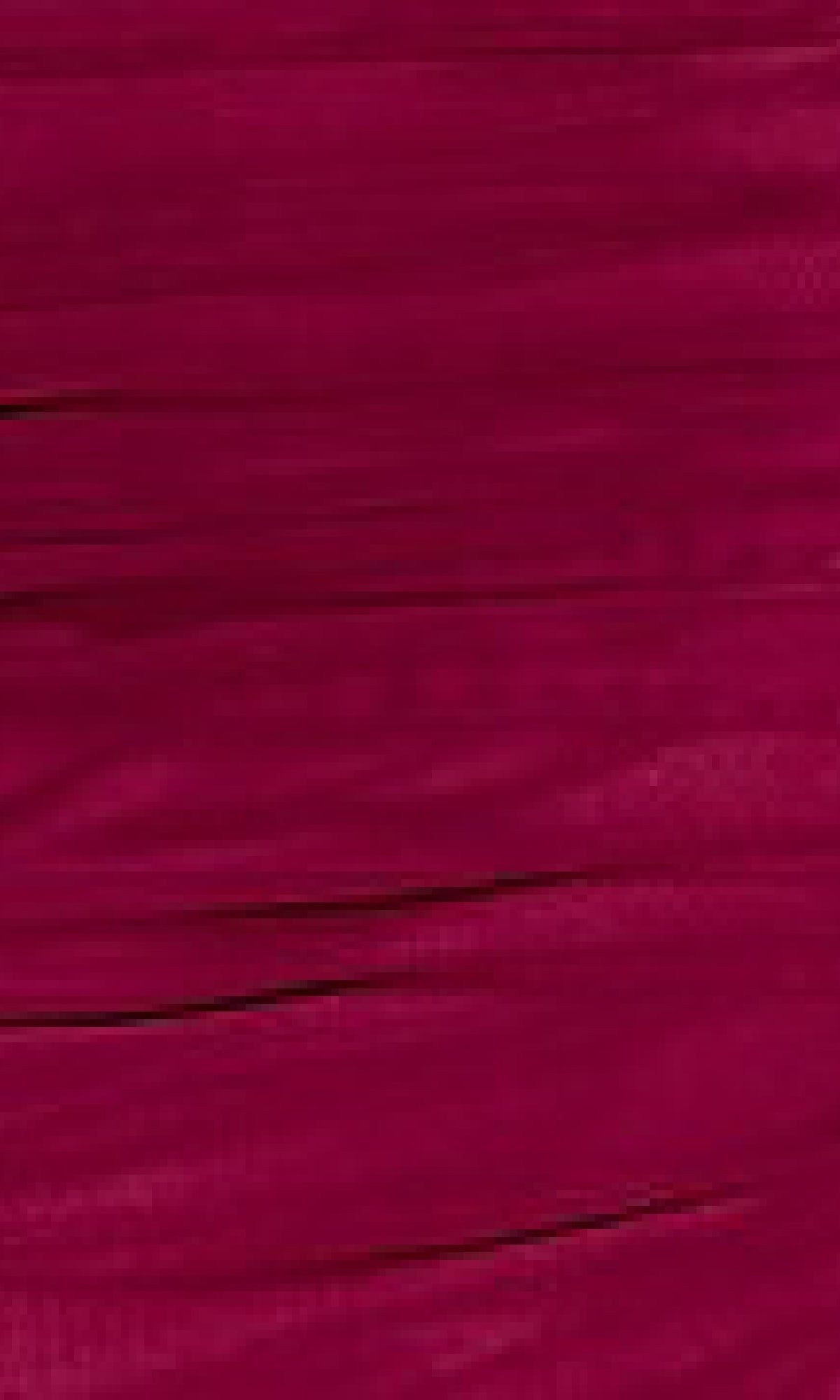Close-up of a textured magenta surface, featuring horizontal streaks and lines, reminiscent of the elegant patterns on the Sheer-Waist Tight Long Prom Dress: Eureka 9077.